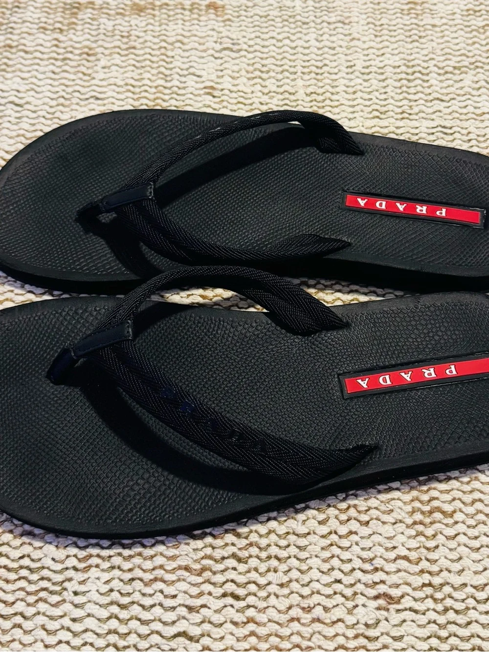 Prada Black Flip-Flop Sandals with Red Logo Accents